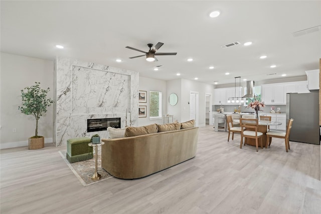 5115 Hohen Ave, Dallas, TX 75215 - living room featuring ceiling fan, recessed lighting, light wood-style floors, and a fireplace