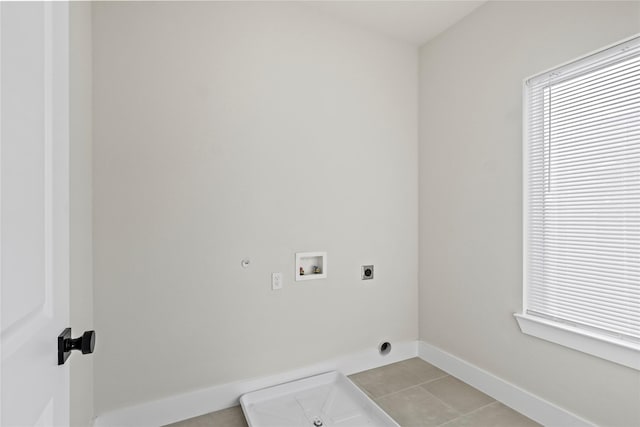 5115 Hohen Ave, Dallas, TX 75215 - laundry area with electric dryer hookup, washer hookup, light tile patterned floors, and gas dryer hookup