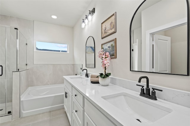 5115 Hohen Ave, Dallas, TX 75215 - bathroom featuring a garden tub, a stall shower, double vanity, and tile patterned floors