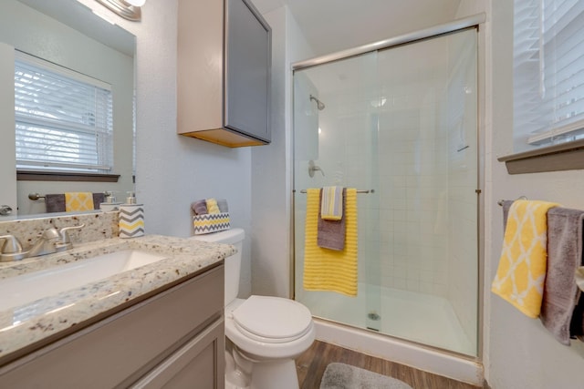 7212 Edinburg Dr, North Richland Hills, TX 76182 - full bath with wood finished floors, a shower stall, and vanity