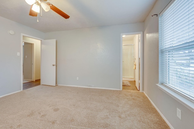 7212 Edinburg Dr, North Richland Hills, TX 76182 - unfurnished bedroom with light colored carpet, ensuite bathroom, and ceiling fan