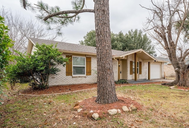 7212 Edinburg Dr, North Richland Hills, TX 76182 - view of front of property featuring an attached garage, brick siding, a shingled roof, and a front lawn