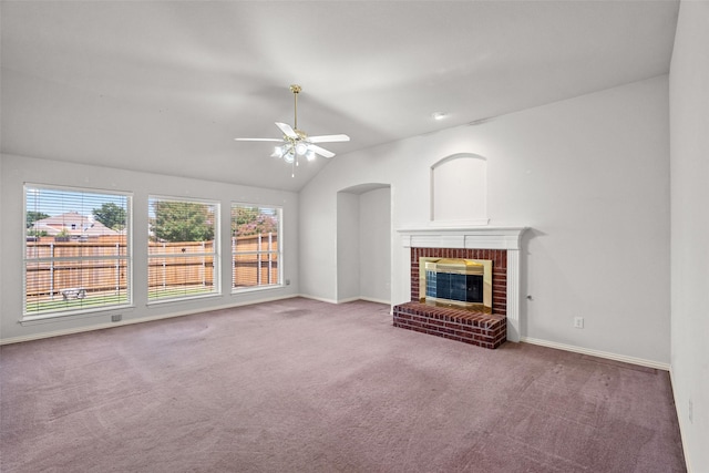 8709 Hartford Dr, Rowlett, TX 75089 - unfurnished living room featuring carpet floors, ceiling fan, a brick fireplace, and lofted ceiling