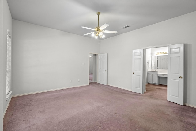 8709 Hartford Dr, Rowlett, TX 75089 - unfurnished bedroom featuring carpet, ensuite bathroom, and a ceiling fan