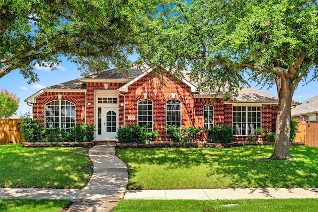 8709 Hartford Dr, Rowlett, TX 75089 - view of front facade with brick siding and a shingled roof