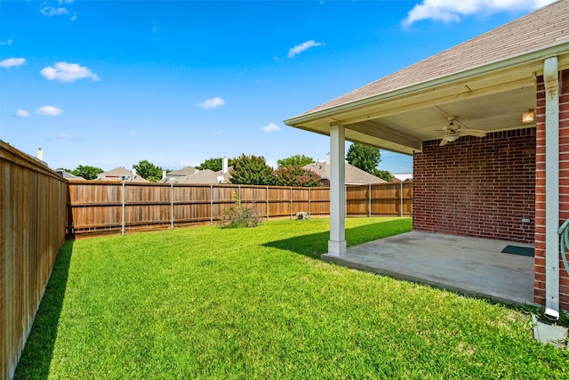 8709 Hartford Dr, Rowlett, TX 75089 - fenced backyard with a ceiling fan and a patio area