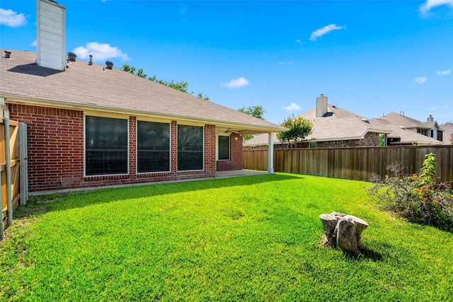 8709 Hartford Dr, Rowlett, TX 75089 - fenced backyard featuring a patio and a ceiling fan