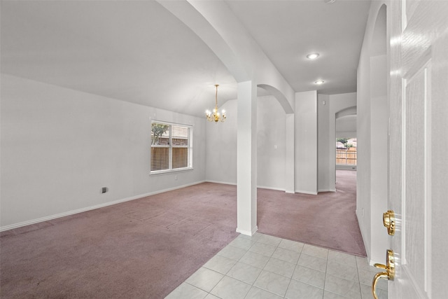 8709 Hartford Dr, Rowlett, TX 75089 - entrance foyer with light colored carpet, arched walkways, a chandelier, light tile patterned floors, and recessed lighting
