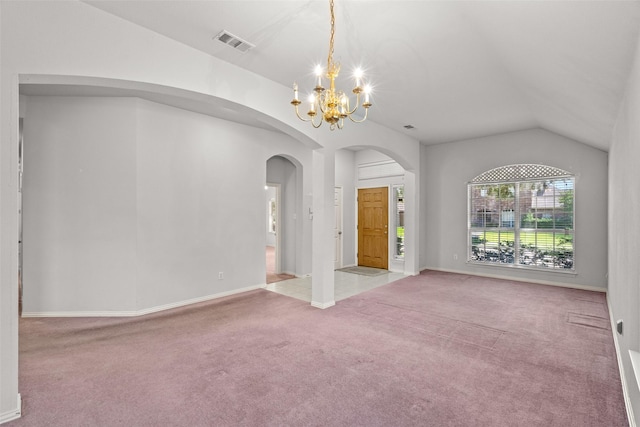 8709 Hartford Dr, Rowlett, TX 75089 - carpeted empty room featuring vaulted ceiling, a chandelier, and arched walkways
