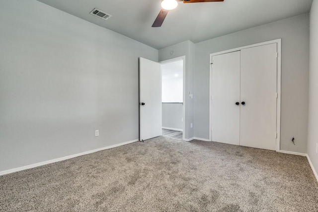1004 Brae Loch Dr, Dallas, TX 75217 - unfurnished bedroom featuring carpet flooring, a closet, and a ceiling fan