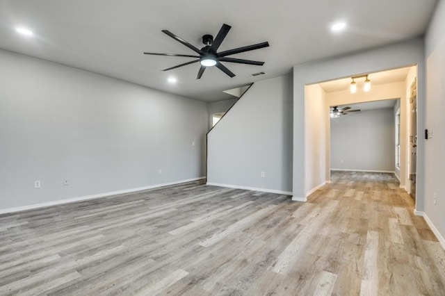1004 Brae Loch Dr, Dallas, TX 75217 - unfurnished living room featuring light wood finished floors, ceiling fan, recessed lighting, and a chandelier