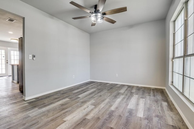 1004 Brae Loch Dr, Dallas, TX 75217 - unfurnished room featuring ceiling fan and wood finished floors
