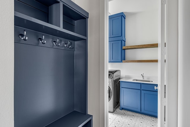 8990 Frostweed Rd, Frisco, TX 75035 - laundry area featuring cabinet space, washer and clothes dryer, and light tile patterned flooring