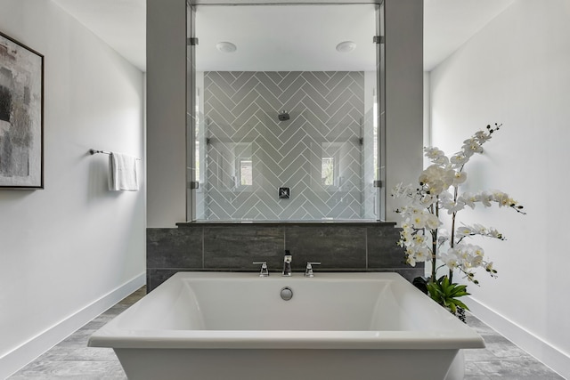 8990 Frostweed Rd, Frisco, TX 75035 - bathroom featuring a freestanding tub and a tile shower
