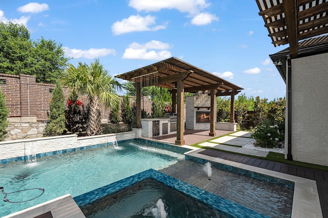 8990 Frostweed Rd, Frisco, TX 75035 - view of swimming pool with exterior kitchen, a fenced backyard, a pergola, a pool with connected hot tub, and a patio area