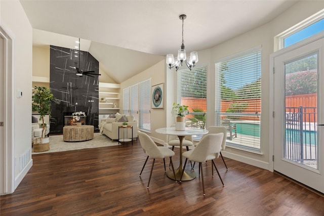 2124 Sandell Dr, Grapevine, TX 76051 - dining space featuring wood finished floors, a chandelier, and vaulted ceiling
