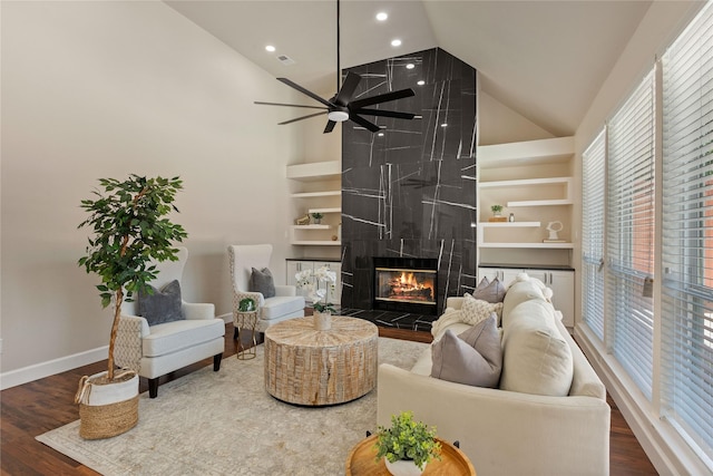 2124 Sandell Dr, Grapevine, TX 76051 - living area with high vaulted ceiling, a premium fireplace, healthy amount of natural light, wood finished floors, and recessed lighting