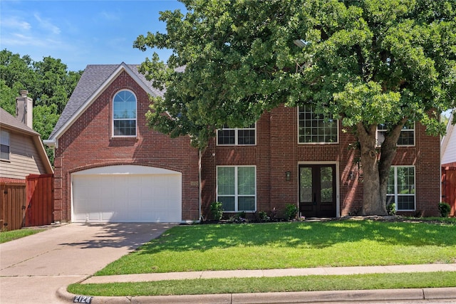 2124 Sandell Dr, Grapevine, TX 76051 - view of front facade with french doors, concrete driveway, a garage, and brick siding
