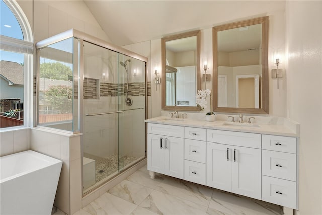 2124 Sandell Dr, Grapevine, TX 76051 - bathroom with double vanity, a freestanding tub, a shower stall, marble look tile flooring, and lofted ceiling