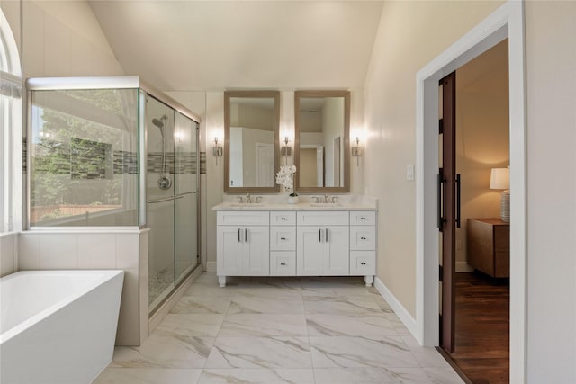 2124 Sandell Dr, Grapevine, TX 76051 - full bath featuring double vanity, a freestanding tub, a stall shower, and marble look tile flooring
