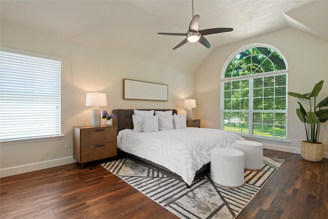 2124 Sandell Dr, Grapevine, TX 76051 - bedroom featuring multiple windows, vaulted ceiling, dark wood finished floors, and ceiling fan