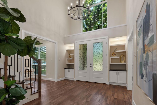 2124 Sandell Dr, Grapevine, TX 76051 - entryway featuring a chandelier, dark wood-type flooring, stairway, a high ceiling, and french doors