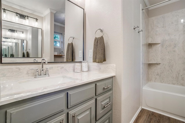3025 Friendswood Dr, Arlington, TX 76013 - bathroom featuring ornamental molding, vanity, wood finished floors, and tub / shower combination