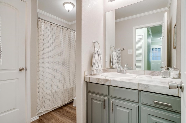 3025 Friendswood Dr, Arlington, TX 76013 - full bathroom featuring crown molding, vanity, wood finished floors, and a shower with curtain