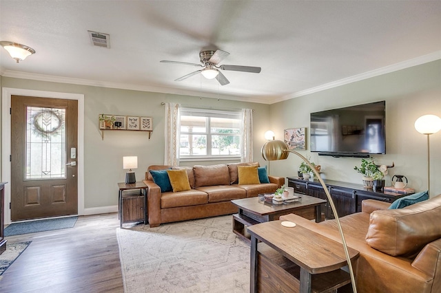 3025 Friendswood Dr, Arlington, TX 76013 - living room featuring ceiling fan, light wood-type flooring, and ornamental molding