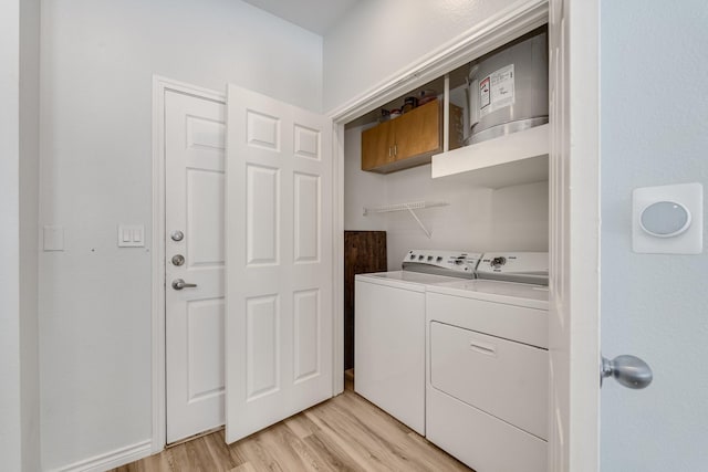 3102 Kings Rd Unit 2104, Dallas, TX 75219 - laundry room with washing machine and clothes dryer and light wood finished floors