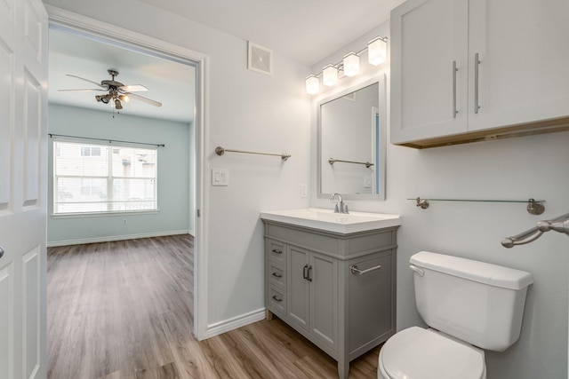 3102 Kings Rd Unit 2104, Dallas, TX 75219 - bathroom with vanity, wood finished floors, and a ceiling fan