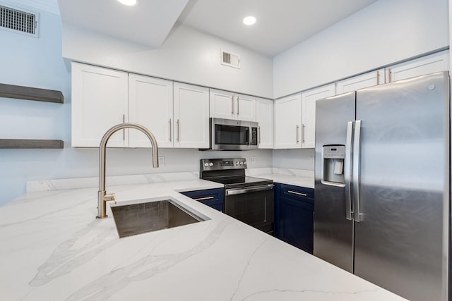 3102 Kings Rd Unit 2104, Dallas, TX 75219 - kitchen with appliances with stainless steel finishes, open shelves, white cabinets, light stone countertops, and recessed lighting