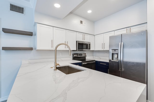 3102 Kings Rd Unit 2104, Dallas, TX 75219 - kitchen with stainless steel appliances, open shelves, white cabinets, light stone countertops, and recessed lighting