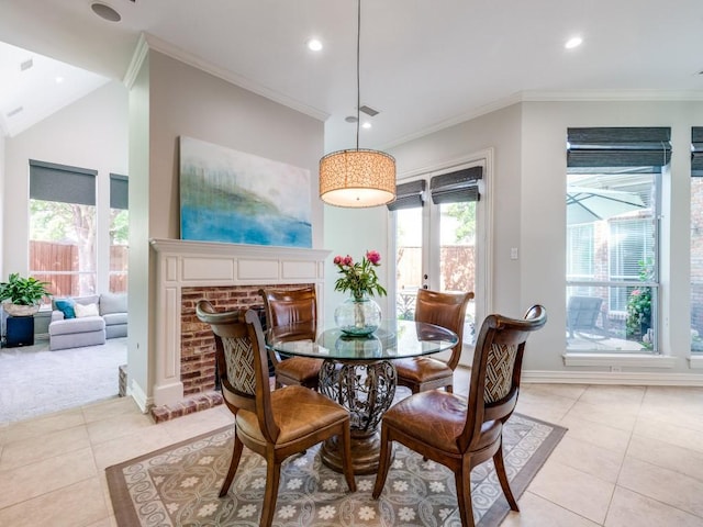 5909 Fossil Ridge Dr, Plano, TX 75093 - dining room with light tile patterned floors, recessed lighting, crown molding, a fireplace, and light colored carpet