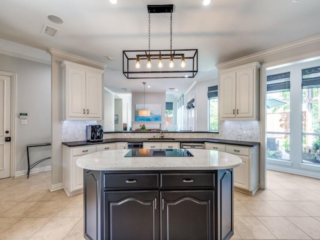 5909 Fossil Ridge Dr, Plano, TX 75093 - kitchen featuring decorative backsplash, white cabinetry, a center island, and crown molding