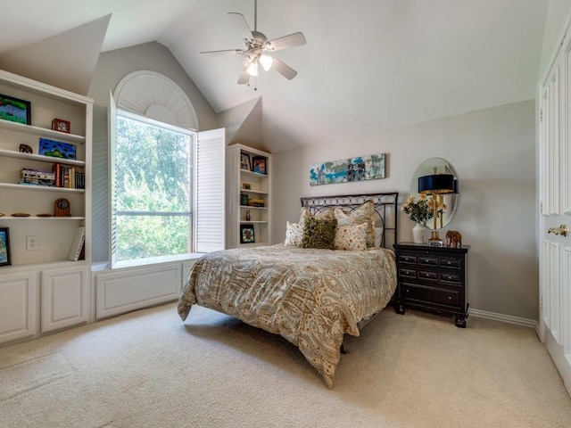 5909 Fossil Ridge Dr, Plano, TX 75093 - bedroom with light colored carpet, lofted ceiling, and a ceiling fan