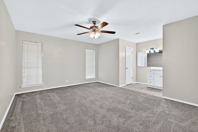 3214 N Marseille Ln, Sherman, TX 75090 - unfurnished bedroom featuring carpet floors, ceiling fan, and ensuite bathroom