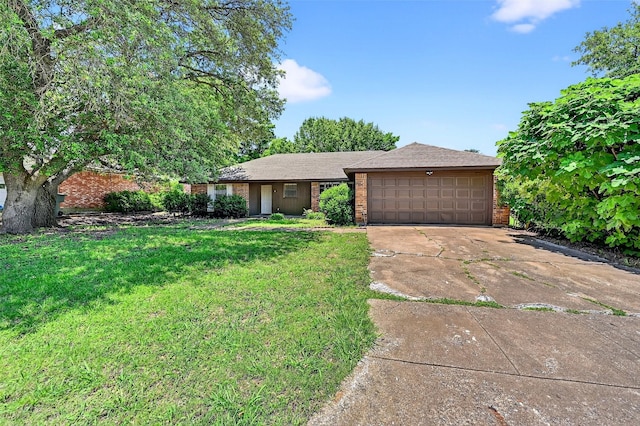 3214 N Marseille Ln, Sherman, TX 75090 - view of front of home with brick siding, a garage, concrete driveway, and a front yard