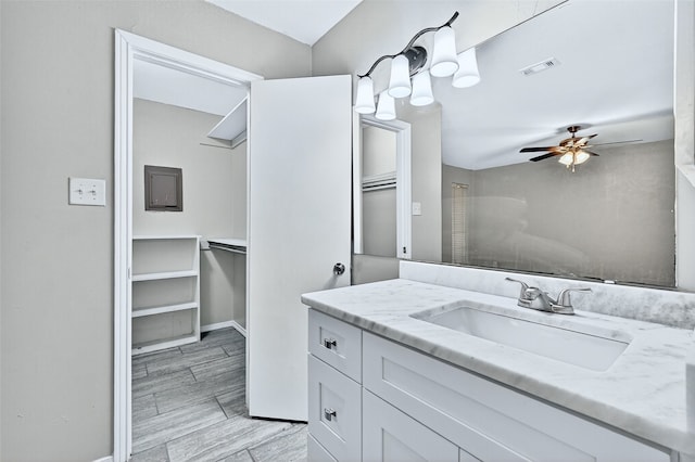 3214 N Marseille Ln, Sherman, TX 75090 - bathroom featuring vanity, a ceiling fan, and a walk in closet