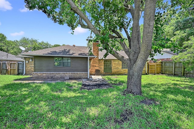 3214 N Marseille Ln, Sherman, TX 75090 - view of front facade featuring a chimney, a fenced backyard, brick siding, and a shingled roof