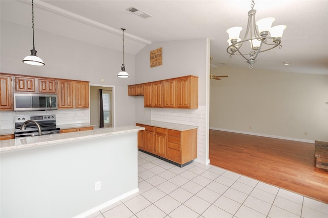 4324 Thames Ct, Flower Mound, TX 75028 - kitchen featuring stainless steel appliances, vaulted ceiling, open floor plan, backsplash, and light stone countertops