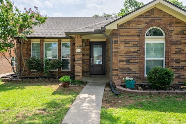 4324 Thames Ct, Flower Mound, TX 75028 - view of exterior entry featuring a lawn, brick siding, and roof with shingles