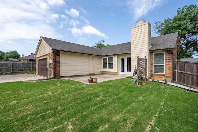 4324 Thames Ct, Flower Mound, TX 75028 - rear view of property featuring french doors, brick siding, a chimney, concrete driveway, and a patio area