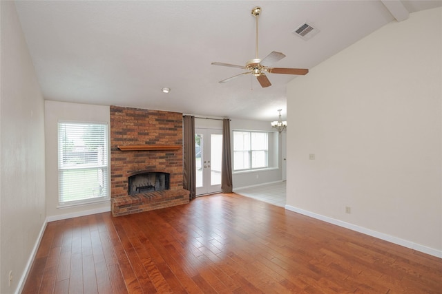 4324 Thames Ct, Flower Mound, TX 75028 - unfurnished living room featuring a chandelier, a brick fireplace, a ceiling fan, and hardwood / wood-style flooring