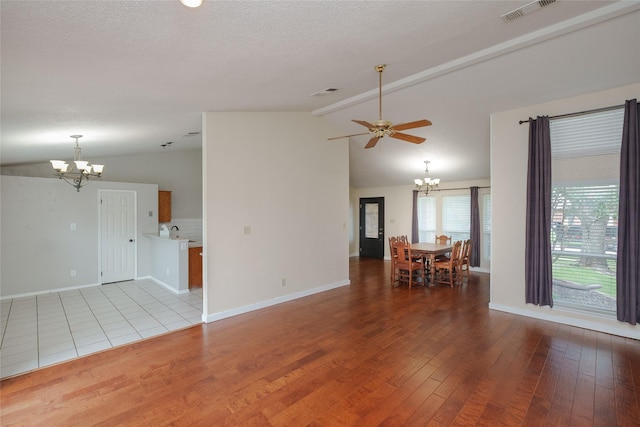 4324 Thames Ct, Flower Mound, TX 75028 - unfurnished living room with a chandelier, hardwood / wood-style floors, a ceiling fan, and a textured ceiling