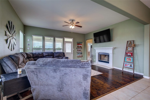 416 Mesa, Lone Oak, TX 75453 - tiled living area featuring a ceiling fan and a fireplace with raised hearth