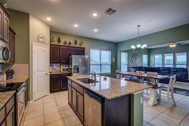 416 Mesa, Lone Oak, TX 75453 - kitchen featuring stainless steel appliances, open floor plan, light tile patterned floors, recessed lighting, and light stone countertops