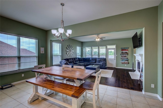 416 Mesa, Lone Oak, TX 75453 - dining room with a chandelier, light tile patterned floors, a fireplace, and ceiling fan