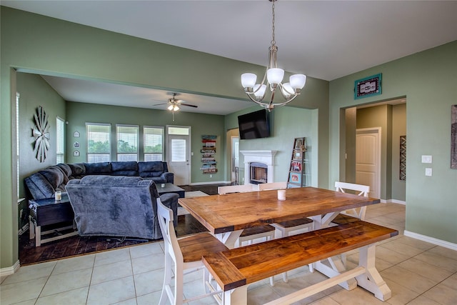 416 Mesa, Lone Oak, TX 75453 - dining space featuring light tile patterned floors, a chandelier, a fireplace, and a ceiling fan