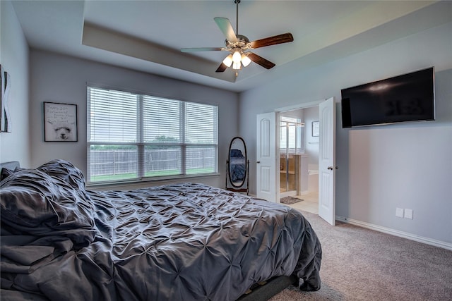 416 Mesa, Lone Oak, TX 75453 - bedroom with carpet floors, a raised ceiling, connected bathroom, and a ceiling fan